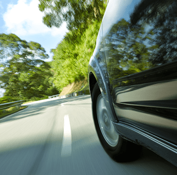 Car in motion on road