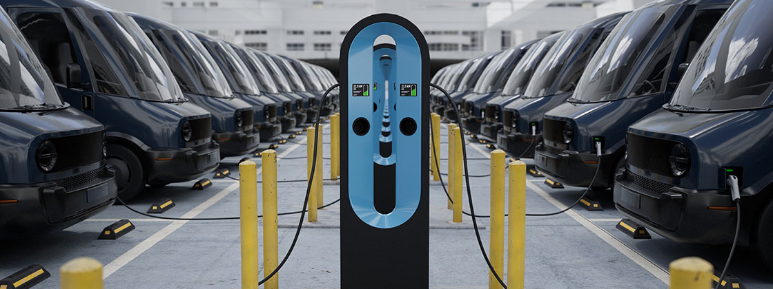 row of electric vans charging