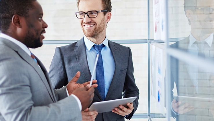 Two corporate men discussing business and finance
